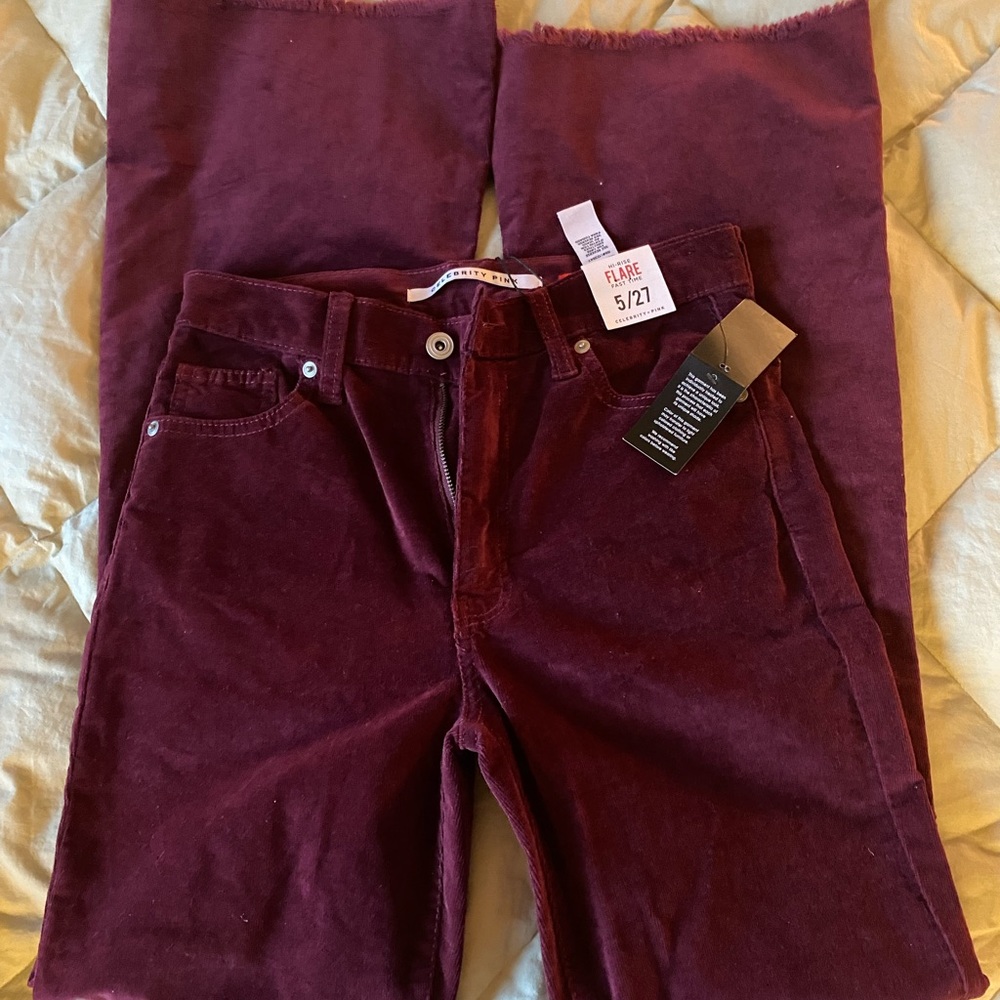 Burgundy flare raw hem jeans